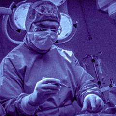 Surgeon in theatre with scalpel