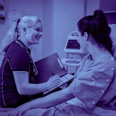 Nursing student on placement speaking with patient