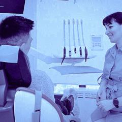 Dental assistant with patient