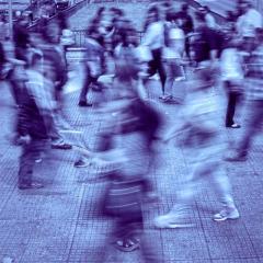 blurry image of a crowd walking 