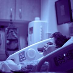 A woman in a hospital bed