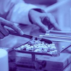 Pharmacist sorting tablets