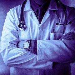 doctor with arms folded.