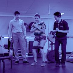 Physiotherapist and student working with a young patient. 