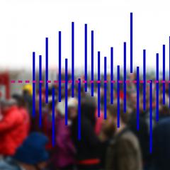 graph overlaid a blurry photo pf a crowd