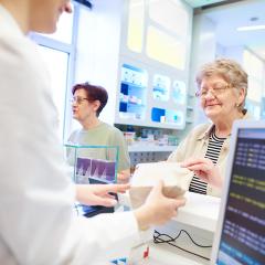 pharmacist and older customer