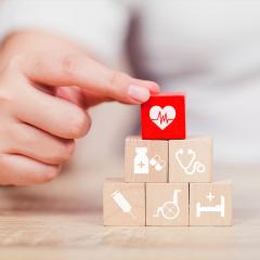 wooden building blocks with health symbols on it. 