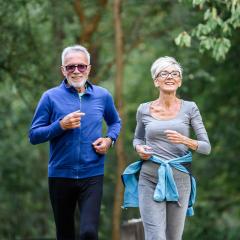 older couple jogging in sportwear